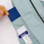 XEB1491 半袖ブルゾン［社名刺繍無料］ ブルゾンには、ブランドの誇りをデザインに秘めたオリジナル刻印ボタンを使用しています。